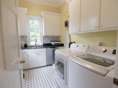 This traditional 1.5 story brick home with finished basement is on The Carolina Country Club in South Carolina - for sale on GolfHomes.com, golf home, golf lot