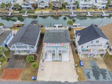 Welcome to 25 Newport Street, a breathtaking coastal retreat on Sea Trail Golf Resort in North Carolina - for sale on GolfHomes.com, golf home, golf lot