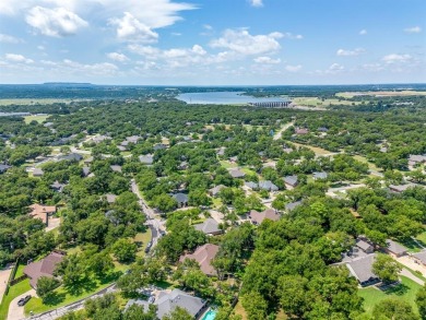 Welcome to this elegant 3-bedroom, 2.5-bath home located in the on Pecan Plantation Country Club in Texas - for sale on GolfHomes.com, golf home, golf lot