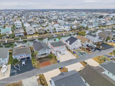 Welcome to 25 Newport Street, a breathtaking coastal retreat on Sea Trail Golf Resort in North Carolina - for sale on GolfHomes.com, golf home, golf lot