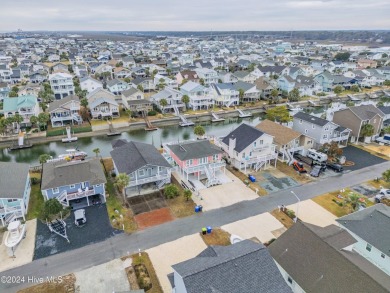 Welcome to 25 Newport Street, a breathtaking coastal retreat on Sea Trail Golf Resort in North Carolina - for sale on GolfHomes.com, golf home, golf lot