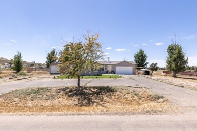 Check out 381 Oakshire Dr.! This home sits on a corner lot on Spring Creek Golf Course in Nevada - for sale on GolfHomes.com, golf home, golf lot