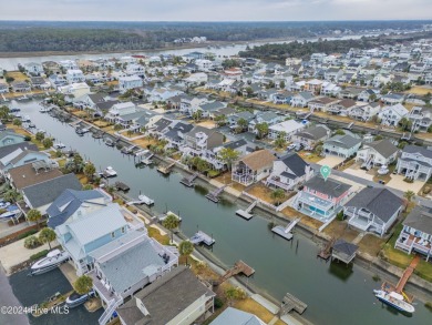 Welcome to 25 Newport Street, a breathtaking coastal retreat on Sea Trail Golf Resort in North Carolina - for sale on GolfHomes.com, golf home, golf lot