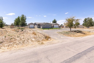 Check out 381 Oakshire Dr.! This home sits on a corner lot on Spring Creek Golf Course in Nevada - for sale on GolfHomes.com, golf home, golf lot