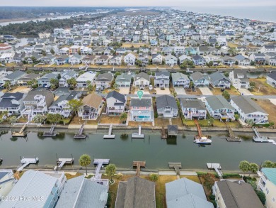Welcome to 25 Newport Street, a breathtaking coastal retreat on Sea Trail Golf Resort in North Carolina - for sale on GolfHomes.com, golf home, golf lot