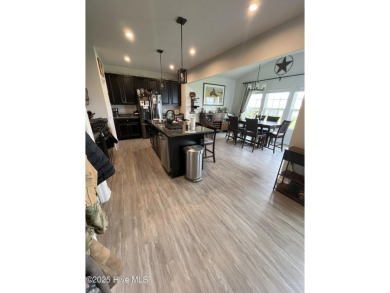 Stunning three-bedroom home in the highly desirable Lakeview on Eagle Creek Golf Club and Grill in North Carolina - for sale on GolfHomes.com, golf home, golf lot