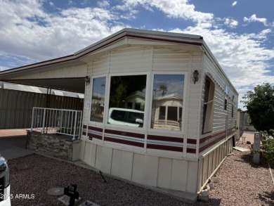 This property offers a great location in the Carriage Manor on Fountain of the Sun Country Club in Arizona - for sale on GolfHomes.com, golf home, golf lot