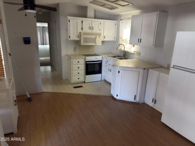 This property offers a great location in the Carriage Manor on Fountain of the Sun Country Club in Arizona - for sale on GolfHomes.com, golf home, golf lot