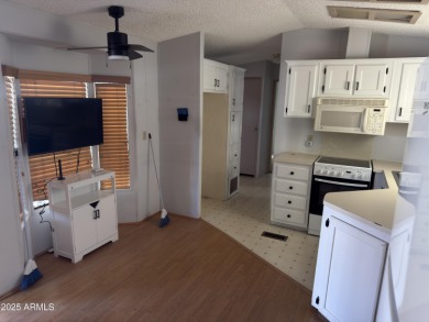 This property offers a great location in the Carriage Manor on Fountain of the Sun Country Club in Arizona - for sale on GolfHomes.com, golf home, golf lot