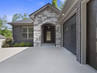 Live your best lake life in this stunning all-brick home on Lake on Isabella Golf Course  in Arkansas - for sale on GolfHomes.com, golf home, golf lot
