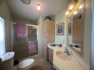 This beautiful partially furnished home with a golf cart on Lake Fairways Country Club in Florida - for sale on GolfHomes.com, golf home, golf lot