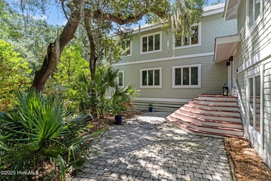 Tucked within the maritime forest and overlooking the 15th on Bald Head Island Golf Club in North Carolina - for sale on GolfHomes.com, golf home, golf lot