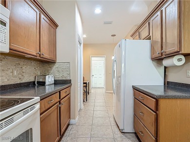 Welcome to this charming Solana home in the friendly HERONS GLEN on Herons Glen Golf and Country Club in Florida - for sale on GolfHomes.com, golf home, golf lot