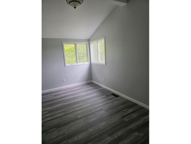Welcome to this beautifully updated 3-bedroom, 3-bathroom home on Lake of Four Seasons Country Club in Indiana - for sale on GolfHomes.com, golf home, golf lot