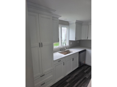 Welcome to this beautifully updated 3-bedroom, 3-bathroom home on Lake of Four Seasons Country Club in Indiana - for sale on GolfHomes.com, golf home, golf lot