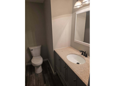 Welcome to this beautifully updated 3-bedroom, 3-bathroom home on Lake of Four Seasons Country Club in Indiana - for sale on GolfHomes.com, golf home, golf lot