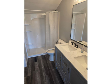 Welcome to this beautifully updated 3-bedroom, 3-bathroom home on Lake of Four Seasons Country Club in Indiana - for sale on GolfHomes.com, golf home, golf lot
