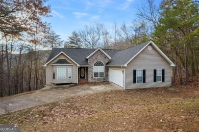 Welcome home to your own private mountainside retreat in Lake on The Highlands Course at Lake Arrowhead in Georgia - for sale on GolfHomes.com, golf home, golf lot