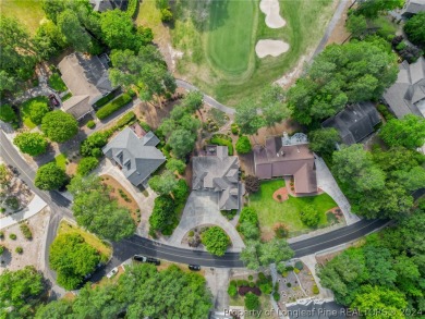 This custom executive home is not just a residence; it's a on Carolina Trace Country Club in North Carolina - for sale on GolfHomes.com, golf home, golf lot