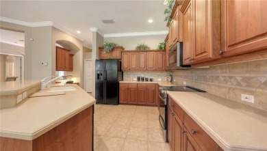 This beautiful custom built home set behind the gates of on Palm Aire Country Club of Sarasota in Florida - for sale on GolfHomes.com, golf home, golf lot
