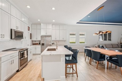 This better-than-new, 2-bedroom plus den/office, 2.5-bath on Sarasota National Golf Club in Florida - for sale on GolfHomes.com, golf home, golf lot