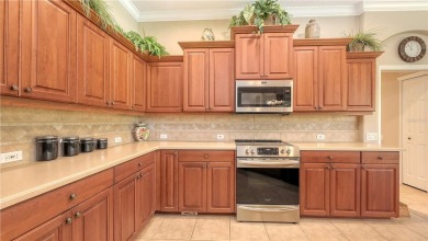 This beautiful custom built home set behind the gates of on Palm Aire Country Club of Sarasota in Florida - for sale on GolfHomes.com, golf home, golf lot