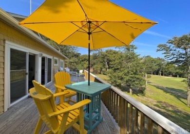 Golf course views over the thirteenth green with a spacious deck on Seascape Golf Links in North Carolina - for sale on GolfHomes.com, golf home, golf lot