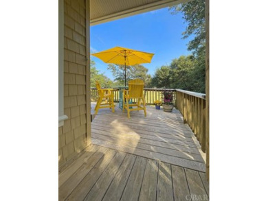 Golf course views over the thirteenth green with a spacious deck on Seascape Golf Links in North Carolina - for sale on GolfHomes.com, golf home, golf lot