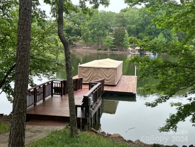 Lakefront living w/private pier in a quiet cove of Badin Lake on Old North State Club in North Carolina - for sale on GolfHomes.com, golf home, golf lot