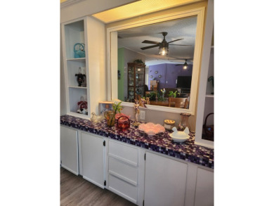 This beautiful 2-bedroom, 2-bath split-floor plan home is on Pine Lakes Country Club in Florida - for sale on GolfHomes.com, golf home, golf lot