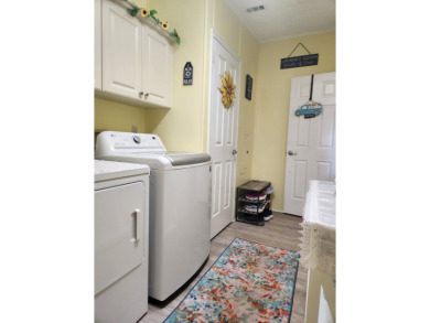 This beautiful 2-bedroom, 2-bath split-floor plan home is on Pine Lakes Country Club in Florida - for sale on GolfHomes.com, golf home, golf lot