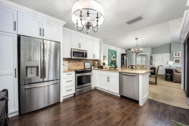 This stunning end-unit condo exudes class and sophistication on Martin Downs Country Club in Florida - for sale on GolfHomes.com, golf home, golf lot