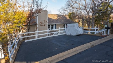 Lovely home with an amazing view of the lake.  Totally turn key on The Oaks Golf Course in Missouri - for sale on GolfHomes.com, golf home, golf lot