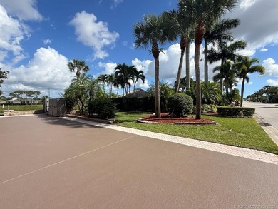 Exceptional Lot with Banyan Tree and Lake Views - Move-In Ready! on St. Lucie Trail Golf Club in Florida - for sale on GolfHomes.com, golf home, golf lot