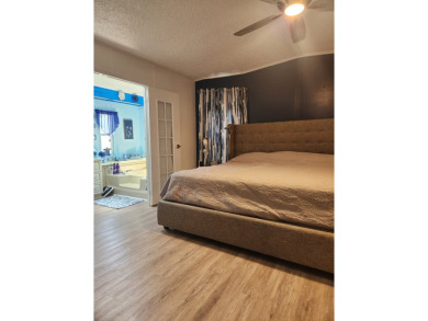 This beautiful 2-bedroom, 2-bath split-floor plan home is on Pine Lakes Country Club in Florida - for sale on GolfHomes.com, golf home, golf lot