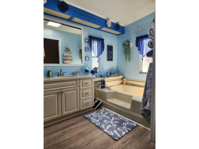 This beautiful 2-bedroom, 2-bath split-floor plan home is on Pine Lakes Country Club in Florida - for sale on GolfHomes.com, golf home, golf lot
