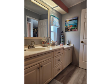 This beautiful 2-bedroom, 2-bath split-floor plan home is on Pine Lakes Country Club in Florida - for sale on GolfHomes.com, golf home, golf lot