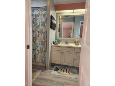 This beautiful 2-bedroom, 2-bath split-floor plan home is on Pine Lakes Country Club in Florida - for sale on GolfHomes.com, golf home, golf lot