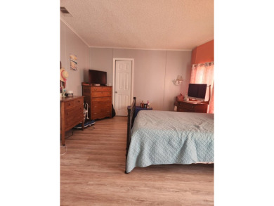This beautiful 2-bedroom, 2-bath split-floor plan home is on Pine Lakes Country Club in Florida - for sale on GolfHomes.com, golf home, golf lot