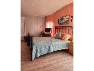 This beautiful 2-bedroom, 2-bath split-floor plan home is on Pine Lakes Country Club in Florida - for sale on GolfHomes.com, golf home, golf lot