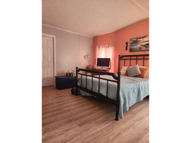 This beautiful 2-bedroom, 2-bath split-floor plan home is on Pine Lakes Country Club in Florida - for sale on GolfHomes.com, golf home, golf lot