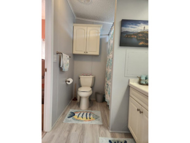 This beautiful 2-bedroom, 2-bath split-floor plan home is on Pine Lakes Country Club in Florida - for sale on GolfHomes.com, golf home, golf lot