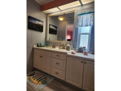 This beautiful 2-bedroom, 2-bath split-floor plan home is on Pine Lakes Country Club in Florida - for sale on GolfHomes.com, golf home, golf lot