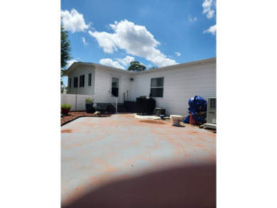 This beautiful 2-bedroom, 2-bath split-floor plan home is on Pine Lakes Country Club in Florida - for sale on GolfHomes.com, golf home, golf lot