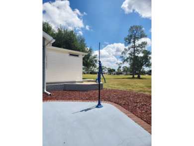 This beautiful 2-bedroom, 2-bath split-floor plan home is on Pine Lakes Country Club in Florida - for sale on GolfHomes.com, golf home, golf lot