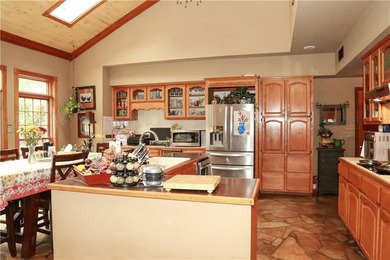 Welcome to 10812 Bay Ridge Drive -- a beautiful two-story home on Lions Den Golf Club in Arkansas - for sale on GolfHomes.com, golf home, golf lot