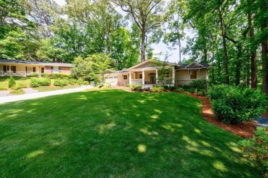 Stunning home with a rocking chair front porch on a friendly on Bobby Jones Golf Club in Georgia - for sale on GolfHomes.com, golf home, golf lot