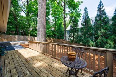 Stunning home with a rocking chair front porch on a friendly on Bobby Jones Golf Club in Georgia - for sale on GolfHomes.com, golf home, golf lot