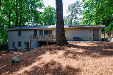 Stunning home with a rocking chair front porch on a friendly on Bobby Jones Golf Club in Georgia - for sale on GolfHomes.com, golf home, golf lot