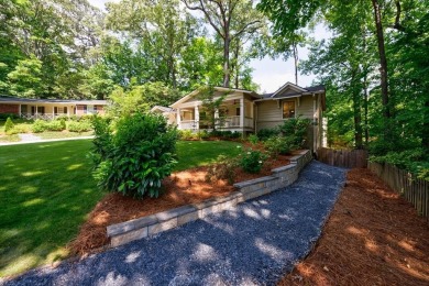 Stunning home with a rocking chair front porch on a friendly on Bobby Jones Golf Club in Georgia - for sale on GolfHomes.com, golf home, golf lot